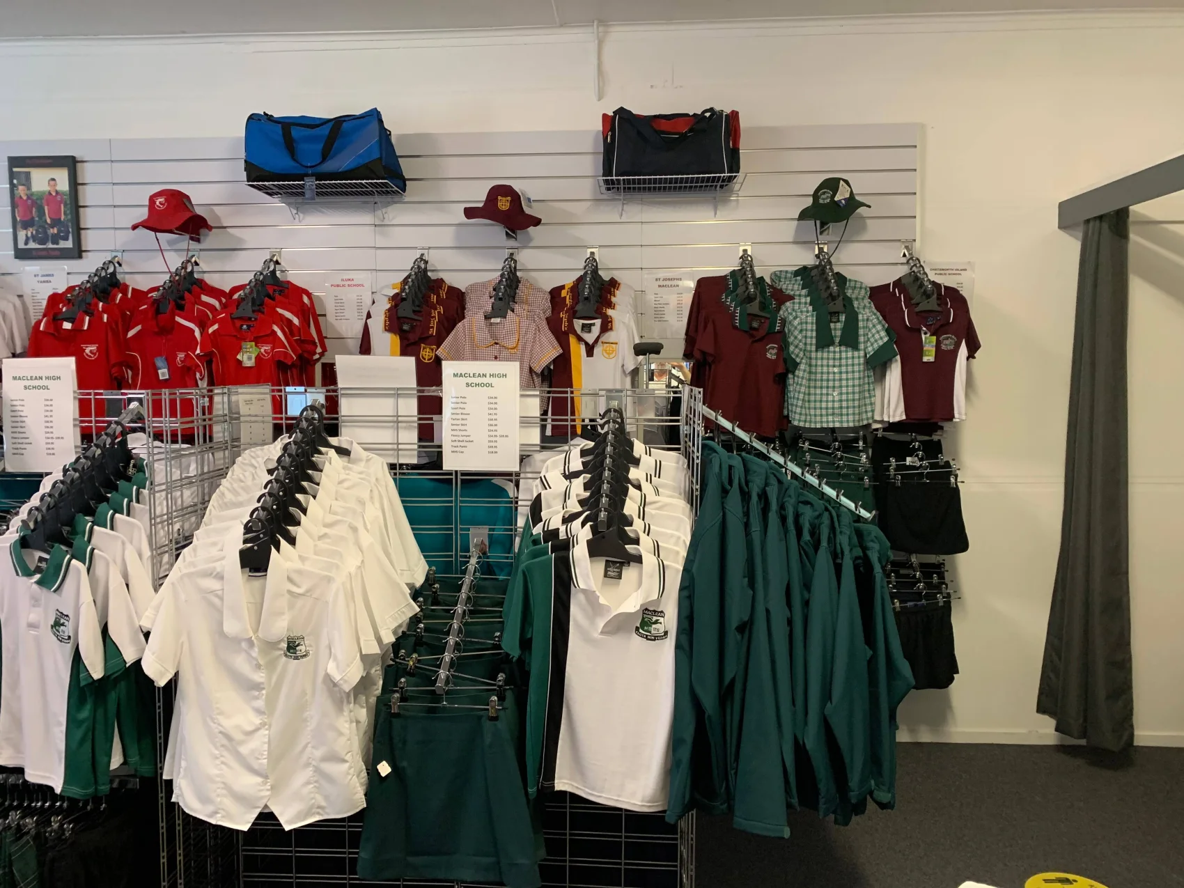 Shelving and stock inside The Uniform Shop at Maclean
